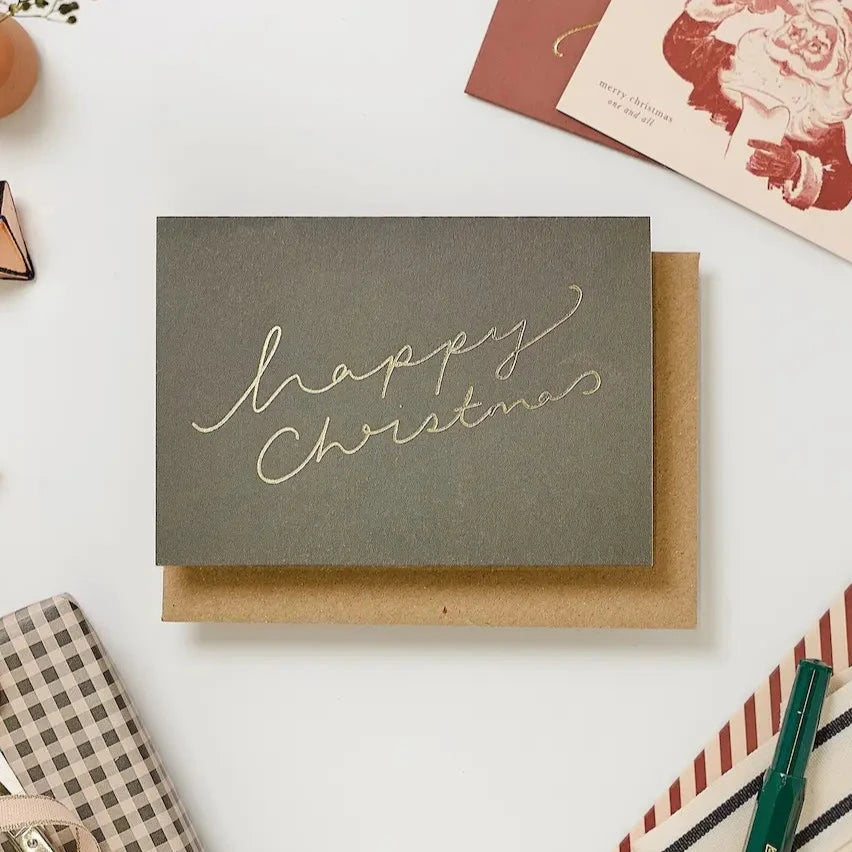 Katie Leamon | Tarjeta Navidad Warm Green Happy Xmas